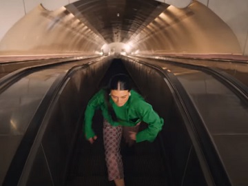 Citi Girl Going Up the Escalator Commercial
